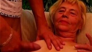 Granny titty fucks her young lover - porn video